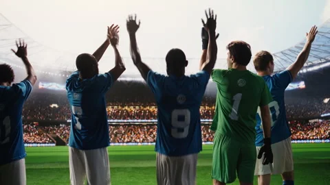 Back view soccer players saluting fans and walking onto pitch before game Stock Footage 337994754
