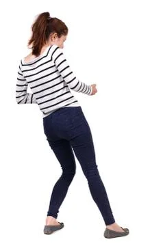 Back view of standing girl pulling a rope from top or cling to s Stock Photos