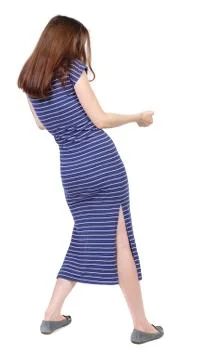 Back view of standing girl pulling a rope from the top or cling Stock Photos