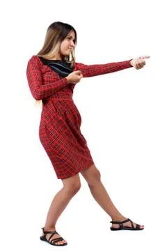 Back view of standing girl pulling a rope from the top or cling Stock Photos