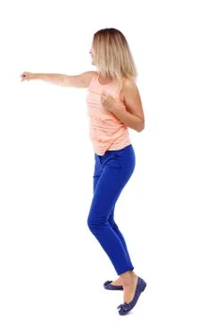 Back view of standing girl pulling a rope from top or cling to s Foto stock