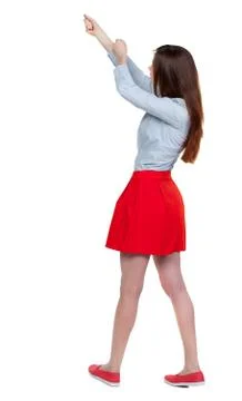 Back view of standing girl pulling a rope from the top or cling Stock Photos
