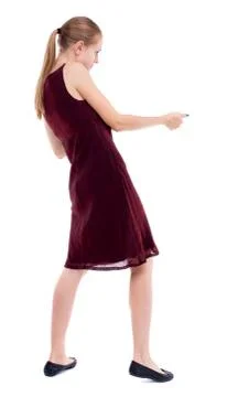 Back view of standing girl pulling a rope from the top or cling Stock Photos