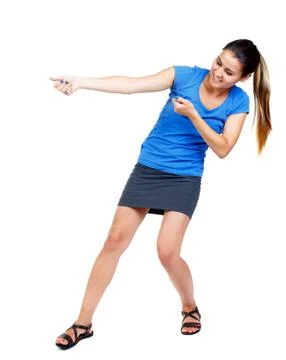 Back view of standing girl pulling a rope from the top or cling Foto stock
