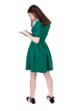 Back view of standing young beautiful  woman using a mobile phon Stock Photos