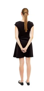 Back view of standing young beautiful  woman Foto stock