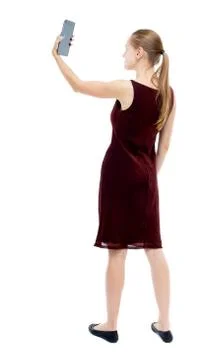 Back view of standing young beautiful  girl with tablet computer Stock Photos