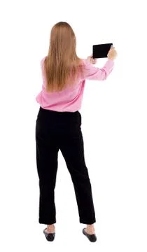 Back view of standing young beautiful  girl with tablet computer Stock Photos