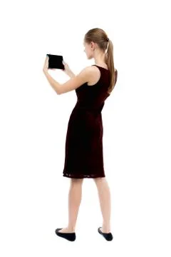 Back view of standing young beautiful  girl with tablet computer Stock Photos