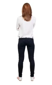 Back view of standing young beautiful  blonde woman in jeans Stock Photos
