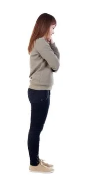 Back view of standing young beautiful  woman Foto stock