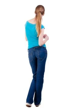 Back view of standing young beautiful  blonde woman Foto stock