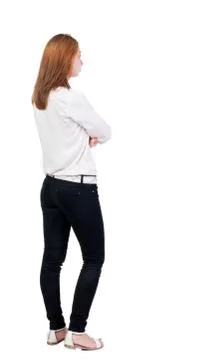 Back view of standing young beautiful  blonde woman in jeans Stock Photos