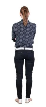 Back view of standing young beautiful  blonde woman in jeans Foto stock