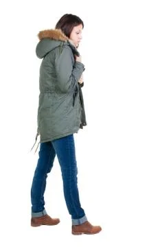 Back view of standing young beautiful  brunette woman in park Stock Photos