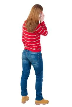 Back view of standing young beautiful  woman and using a mobile Stock Photos