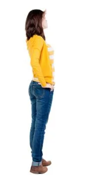 Back view of standing young beautiful  brunette woman in yellow Stock Photos