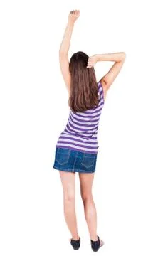 Back view of standing young beautiful  woman thumbs up Foto stock