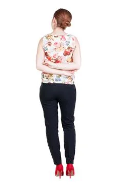 Back view of standing young beautiful  redhead woman Stock Photos
