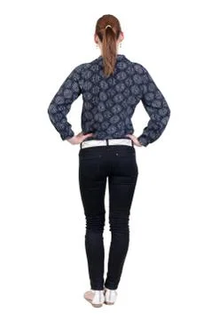 Back view of standing young beautiful  blonde woman in jeans Stock-Fotos