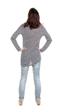 Back view of standing young beautiful  brunette woman in striped Stock Photos
