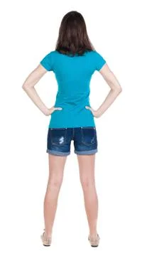 Back view of standing young beautiful  brunette woman in shorts Foto stock