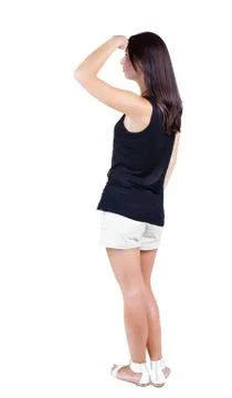 Back view of standing young beautiful  brunette woman Foto stock