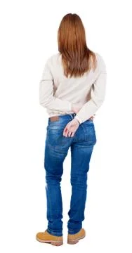 Back view of standing young beautiful  woman in jeans Foto stock