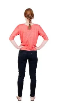 Back view of standing young beautiful  blonde woman in jeans Stock-Fotos