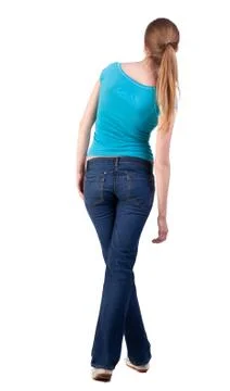 Back view of standing young beautiful  blonde woman Foto stock