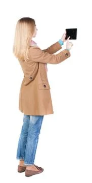 Back view of standing young beautiful  girl with tablet computer Stock Photos