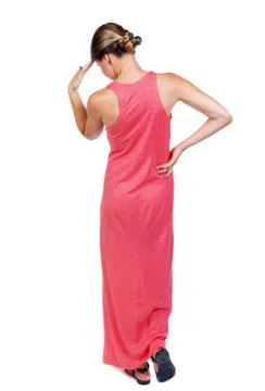 Back view of standing young beautiful  woman.  Girl scratching h Stock Photos