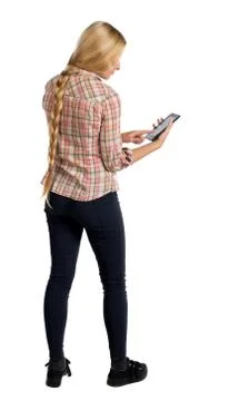 Back view of standing young beautiful  girl with tablet computer in the hands Stock Photos