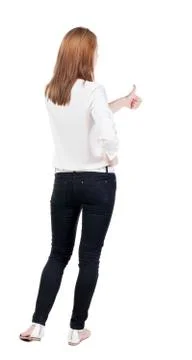 Back view of standing young redhead business woman showing thumb Stock Photos