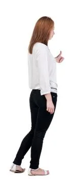 Back view of standing young redhead business woman showing thumb Stock Photos