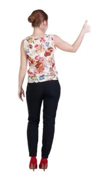 Back view of standing young redhead business woman showing thumb Stock Photos