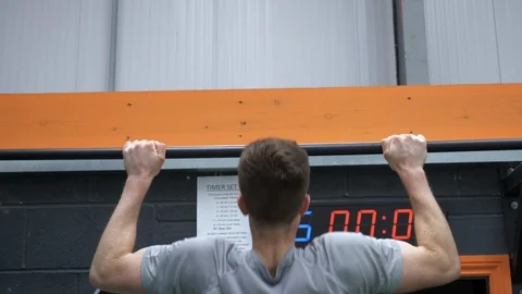 Back View Strong Man Doing Pull Ups Stock Footage 111801198