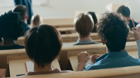 Back View of the Students in the Lecture Hall Listening to a Prominent Professor Stock Footage 87972546