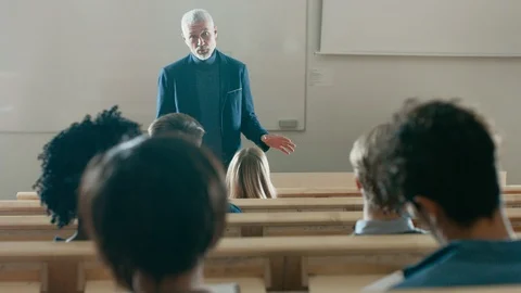 Back View of the Students in the Lecture Hall Listening to a Prominent Professor Stock Footage 87972757