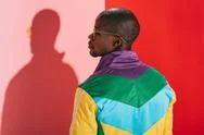 Back View Of Stylish African American Man In Colorful Jacket And Sunglasses L Stock Photos