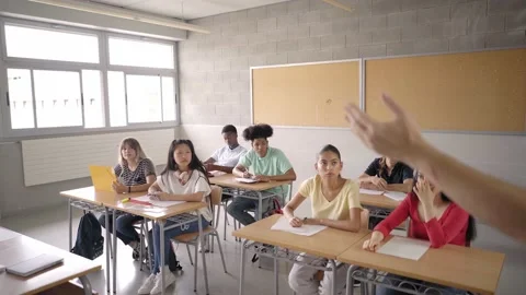 Back view of the teacher teaching his students. Young multiracial students Stock Footage 161208907