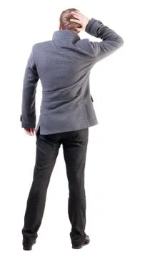 Back view of thinking business man in coat Stock-Fotos