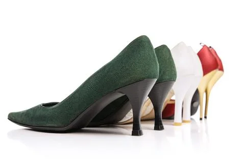 Back view of three pairs of woman's vintage style footwear. High-heeled shoes Stock Photos