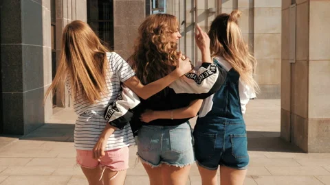 Back view of three young female hipster friends Stock Footage 141786340