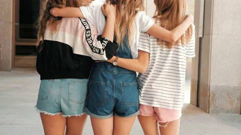 Back view of three young female hipster friends Stock Footage 141787997