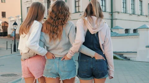 Back view of three young female hipster friends Stock Footage 141804904
