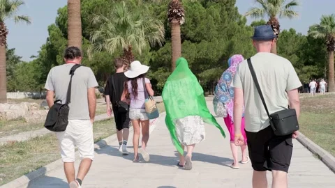 Back view tourist group going on excursion in Turkey, UNESCO World Heritage Stock-Footage 231596194