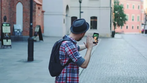 Back view of tourist making video call with female tourist from other place Stock Footage 142916987