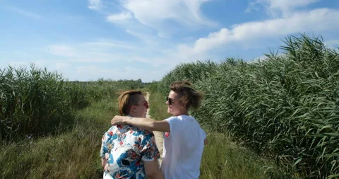 Back view  tracking shot female same-sex couple 動画素材 135715265
