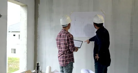 Back view two asian of building architect construction engineer have meeting Stock Footage 146681828